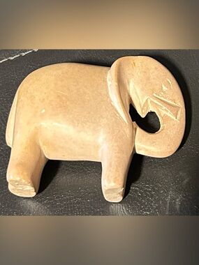 vintage, hand-carved soapstone elephant figurine. 
Beige Decorative Sculpture